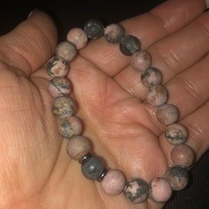 Matte rhodochrosite w small Shugnite in middle